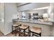 Kitchen featuring granite countertops, stainless steel appliances, and a breakfast bar with seating at 353 Tall Oaks Trl, Fort Mill, SC 29715