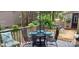 Cozy outdoor patio featuring a dining set, comfortable seating, and a relaxing ambiance amidst natural surroundings at 353 Tall Oaks Trl, Fort Mill, SC 29715
