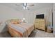 Comfortable bedroom with a ceiling fan, neutral decor, and a window providing natural light at 5640 Sharon Rd, Charlotte, NC 28210