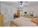 Bright bedroom featuring a ceiling fan, carpet floors, closet, and ample storage space at 5640 Sharon Rd, Charlotte, NC 28210