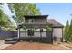 Backyard features a deck with hanging planters, wood fence, landscaping, and home's exterior at 6501 Piney Path Rd, Charlotte, NC 28212