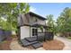 Home's backyard features a pergola-covered porch, wood siding, landscaping, and chimney at 6501 Piney Path Rd, Charlotte, NC 28212