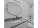 Modern bathroom features an oval mirror, modern fixtures, and combined shower and tub at 6501 Piney Path Rd, Charlotte, NC 28212