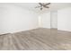 Spacious bedroom features modern flooring and ample natural light at 7416 Quail Ridge Dr, Charlotte, NC 28226