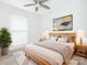 Comfortable bedroom with a ceiling fan, a plush rug, and a stylish wood bed frame at 7416 Quail Ridge Dr, Charlotte, NC 28226