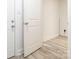 Entryway with grey vinyl flooring and white painted walls at 7416 Quail Ridge Dr, Charlotte, NC 28226