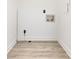 A utility room with vinyl flooring and white painted walls at 7416 Quail Ridge Dr, Charlotte, NC 28226