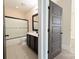 Bathroom with a dark vanity, shower with sliding doors, modern fixtures, and neutral tile flooring at 751 Terrace Park, Rock Hill, SC 29730