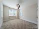 Neutral bedroom featuring plush carpeting, a ceiling fan, and bright natural light from multiple windows at 751 Terrace Park, Rock Hill, SC 29730