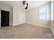 Neutral bedroom featuring plush carpeting, a ceiling fan, and bright natural light from a window at 751 Terrace Park, Rock Hill, SC 29730