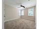 Neutral bedroom featuring plush carpeting, a ceiling fan, and bright natural light from multiple windows at 751 Terrace Park, Rock Hill, SC 29730