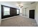 Bedroom with wood accent wall, built-in shelves, and carpet flooring at 751 Terrace Park, Rock Hill, SC 29730
