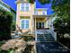 Charming yellow two-story home with a welcoming front porch and manicured landscaping at 751 Terrace Park, Rock Hill, SC 29730