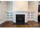 Close-up of fireplace with black tile surround and built-in shelving at 751 Terrace Park, Rock Hill, SC 29730
