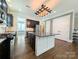 Spacious kitchen with dark cabinets, a large island, granite countertops, and stainless steel appliances at 751 Terrace Park, Rock Hill, SC 29730