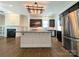 Modern kitchen with a large island, stainless steel appliances, and stylish lighting at 751 Terrace Park, Rock Hill, SC 29730