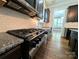Modern kitchen features stainless steel appliances, granite countertops, and subway tile backsplash at 751 Terrace Park, Rock Hill, SC 29730