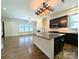 Open kitchen with island, stainless appliances, connects seamlessly to the cozy living area at 751 Terrace Park, Rock Hill, SC 29730