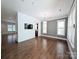 Spacious living room with hardwood floors, stylish lighting, and large windows at 751 Terrace Park, Rock Hill, SC 29730