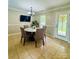 Cozy dining area featuring a modern table and chairs, with access to the backyard at 7918 Boars Head Ct, Charlotte, NC 28214
