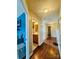 This hallway connects multiple rooms and features wood-look floors and neutral walls at 7918 Boars Head Ct, Charlotte, NC 28214