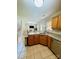 Kitchen with oak cabinets, granite countertops, stainless steel appliances and adjacent dining area at 7918 Boars Head Ct, Charlotte, NC 28214