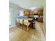 Open kitchen featuring a breakfast bar, oak cabinets, and modern appliances at 7918 Boars Head Ct, Charlotte, NC 28214