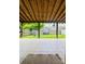 Enjoy a private patio area with tiled floors and a tranquil view of the fenced backyard, ideal for outdoor gatherings at 7918 Boars Head Ct, Charlotte, NC 28214