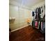 This walk-in closet features wood-look floors and wire shelving for ample storage at 7918 Boars Head Ct, Charlotte, NC 28214