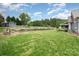 Expansive backyard with lush green grass and manicured landscaping, great for outdoor activities at 8993 Plank Rd, Norwood, NC 28128