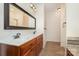 Elegant bathroom featuring double vanity sinks, a large mirror, and a separate shower area at 8993 Plank Rd, Norwood, NC 28128