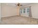Spacious bedroom featuring neutral walls, a ceiling fan, and a window with natural light at 8993 Plank Rd, Norwood, NC 28128