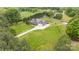 A beautiful view of the home, the large manicured lawn, and the extra storage on the property at 8993 Plank Rd, Norwood, NC 28128