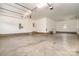 Spacious garage with ample lighting and finished brick, perfect for multi-vehicle parking at 8993 Plank Rd, Norwood, NC 28128