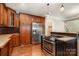 Gourmet kitchen featuring custom cabinetry, a stainless steel refrigerator, and a chef's grade oven at 8993 Plank Rd, Norwood, NC 28128