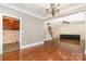 Open-concept living area showcases hardwood floors, a staircase, and seamless flow into the modern kitchen at 8993 Plank Rd, Norwood, NC 28128