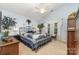 Charming bedroom with blue walls, a decorative quilt, and ceiling fan at 9011 Brad Ct, Matthews, NC 28104