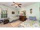 Inviting bedroom featuring twin beds, a ceiling fan, and natural light at 9011 Brad Ct, Matthews, NC 28104