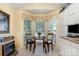 Cozy kitchen breakfast nook featuring a fireplace and a bay window at 9011 Brad Ct, Matthews, NC 28104