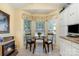 Cozy kitchen breakfast nook featuring a fireplace and a bay window at 9011 Brad Ct, Matthews, NC 28104