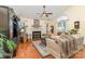 Elegant living room showcasing a fireplace, hardwood floors, lots of plants and natural lighting at 9011 Brad Ct, Matthews, NC 28104