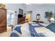 Comfortable bedroom with a decorative quilt, adjoining bathroom, and neutral carpet at 9011 Brad Ct, Matthews, NC 28104