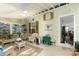 Bright sunroom with comfortable seating, multiple windows, and an adjoining room at 9011 Brad Ct, Matthews, NC 28104
