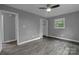 Spacious bedroom with hardwood floors, a ceiling fan, and ample natural light at 102 Central Ave, Bessemer City, NC 28016
