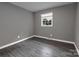Cozy bedroom with hardwood floors and natural light at 102 Central Ave, Bessemer City, NC 28016