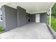Spacious carport featuring concrete flooring and gray brick walls at 102 Central Ave, Bessemer City, NC 28016