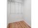 Walk-in closet with hardwood floors and wire shelving at 10728 Forest Dr, Matthews, NC 28105