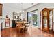 Cozy dining area featuring natural light, a sliding glass door, and wood flooring at 112 E Heart Pine Ln, Statesville, NC 28677