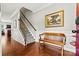 Foyer features hardwood floors, staircase, bench seating and views into the living spaces at 112 E Heart Pine Ln, Statesville, NC 28677