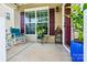The home features a cozy front porch with rocking chair, plants and a view of the community at 112 E Heart Pine Ln, Statesville, NC 28677